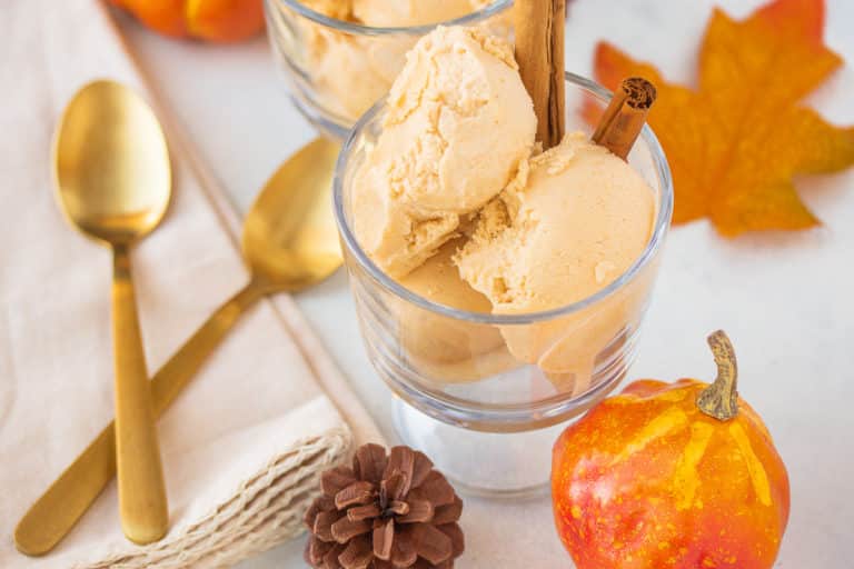 bowl of ice cream with a gold spoon