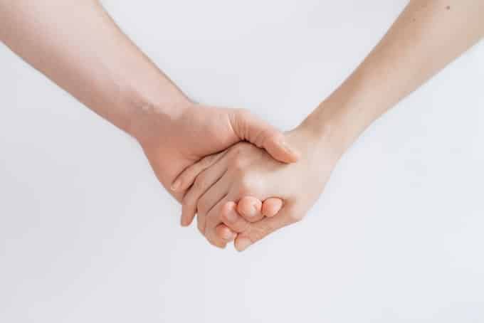 friends holding hands.