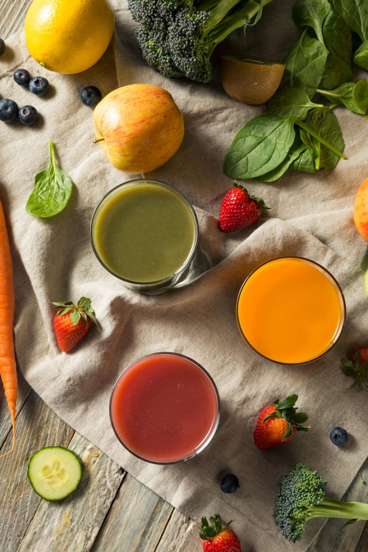 vegetable and fruit juices on a countertop.