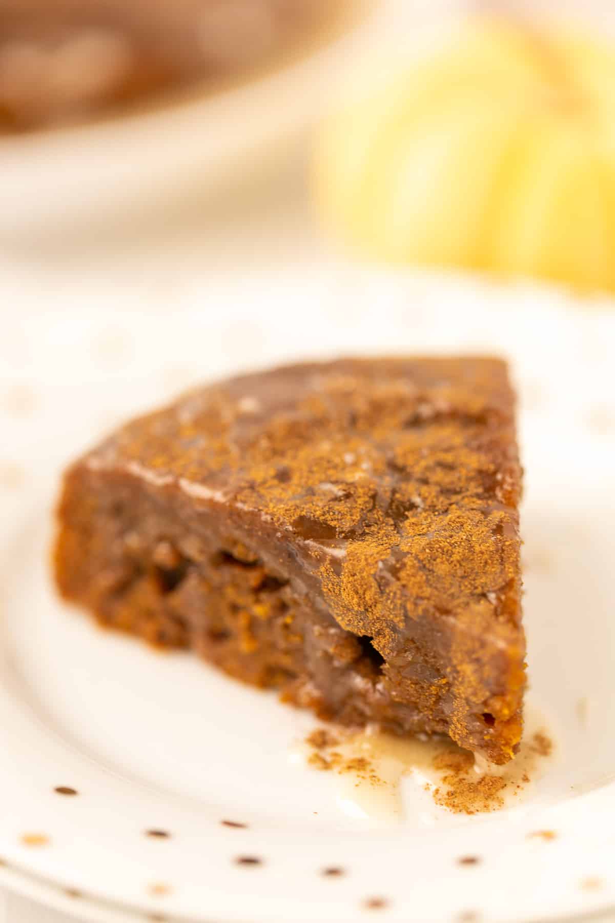 slice of instant pot pumpkin cake on a plate ready to eat.