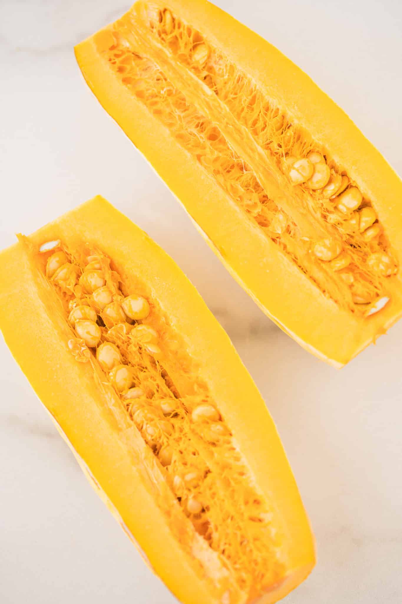 delicata squash cut in half lengthwise.