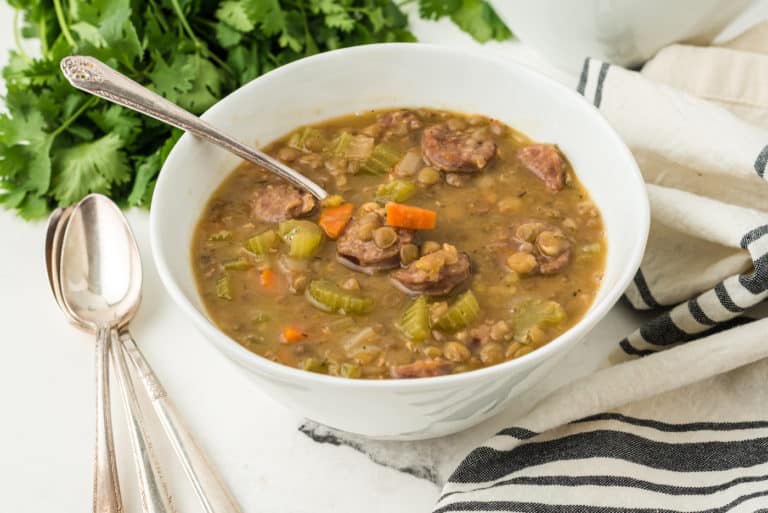 instant pot lentil soup with sausage white bowl.