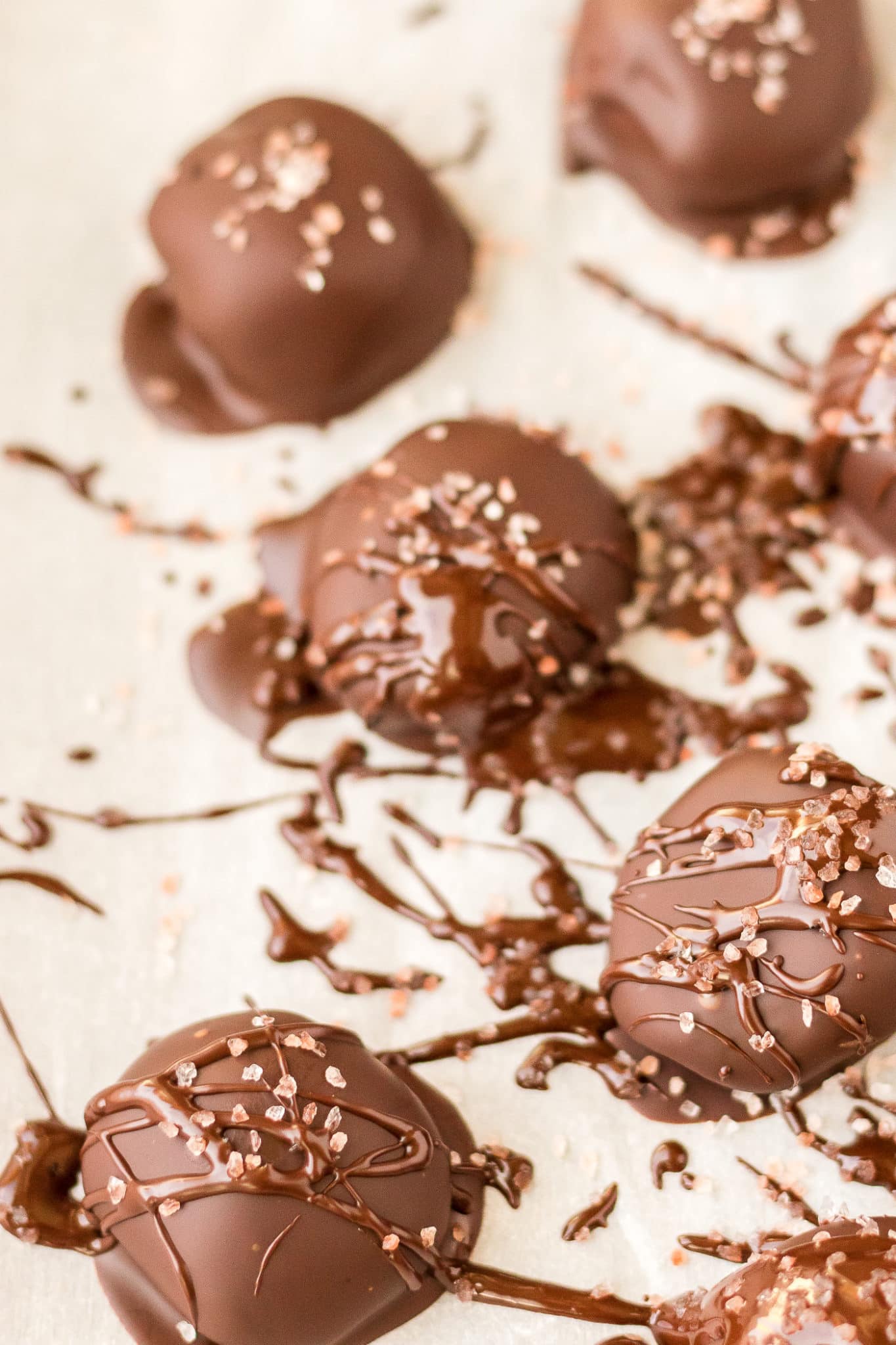 chocolate truffles on parchment paper waiting to set.