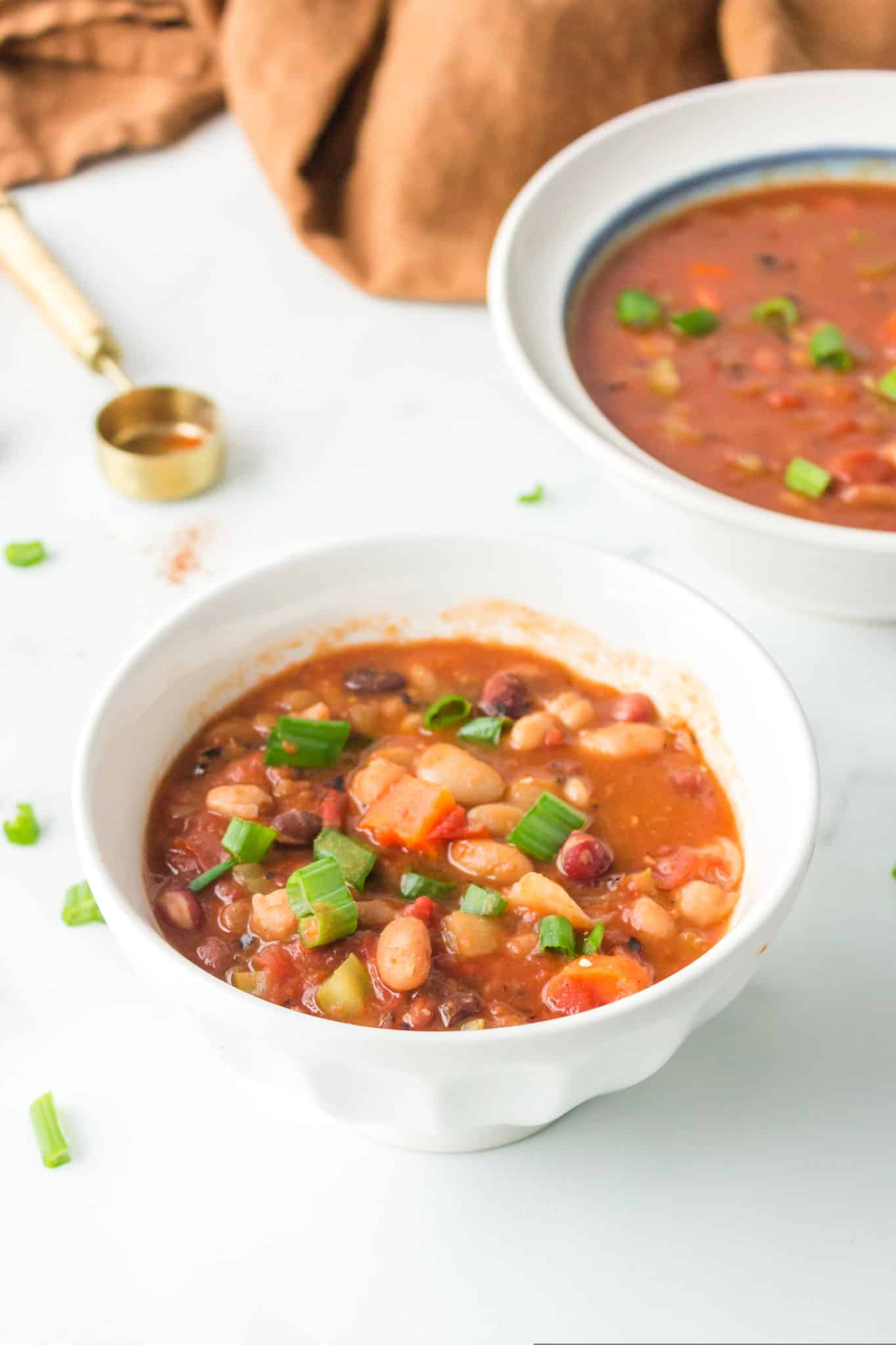 two bowls of cooked instant pot 15 bean soup.