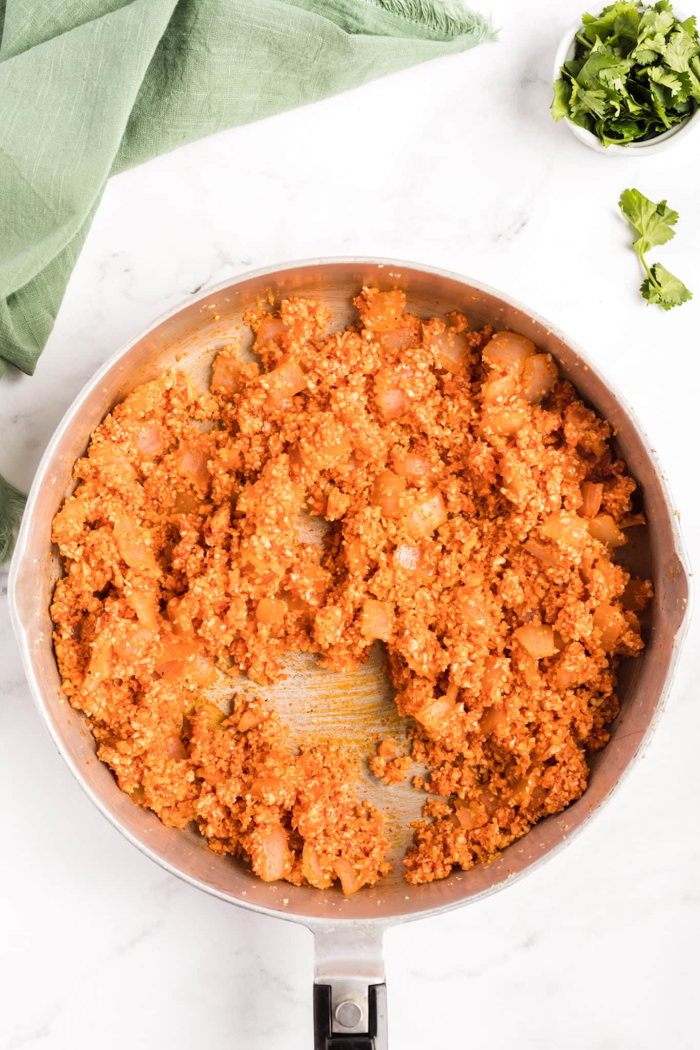 A skillet with keto spanish rice in it
