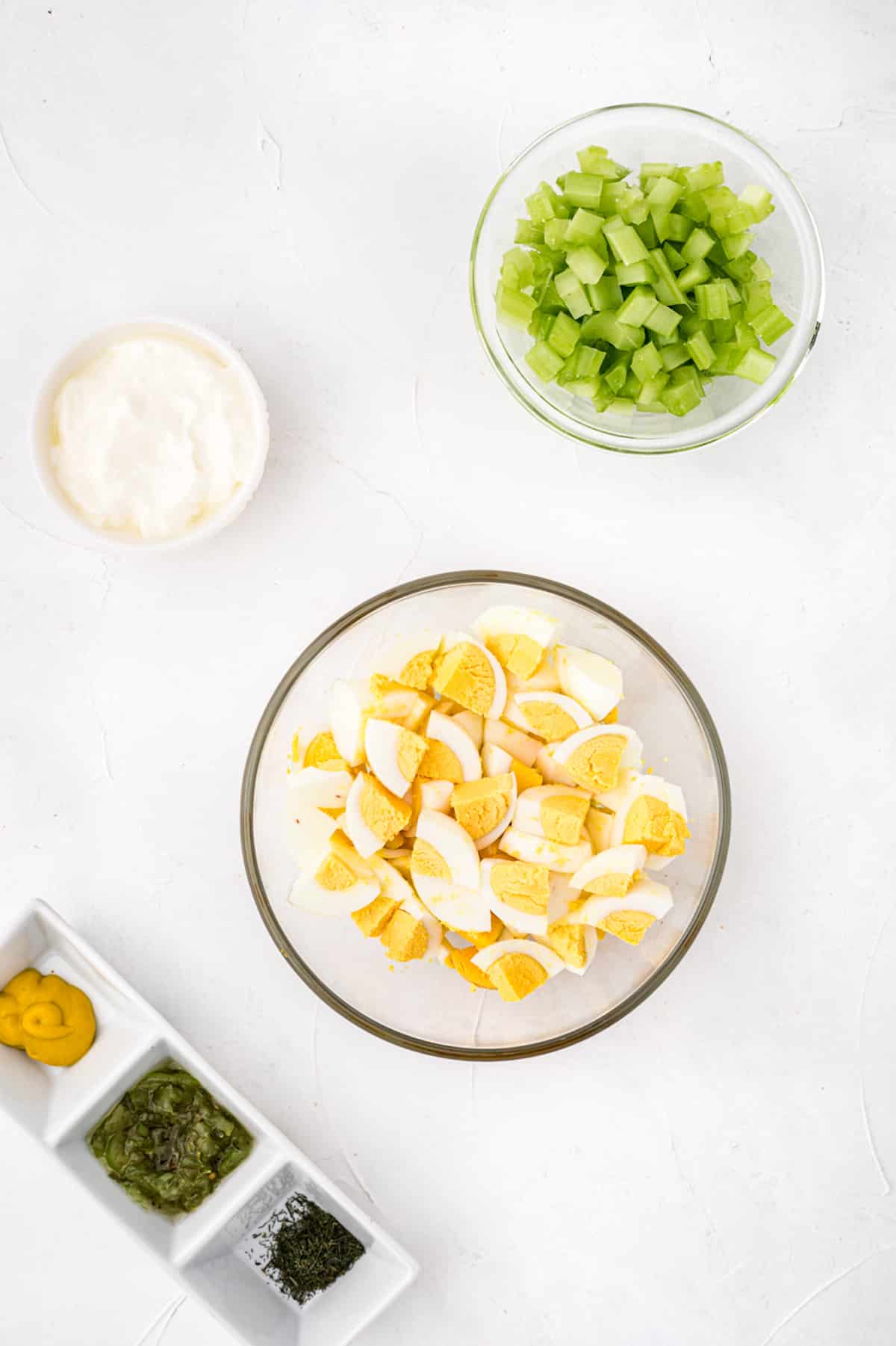 Chopped up eggs in a bowl.