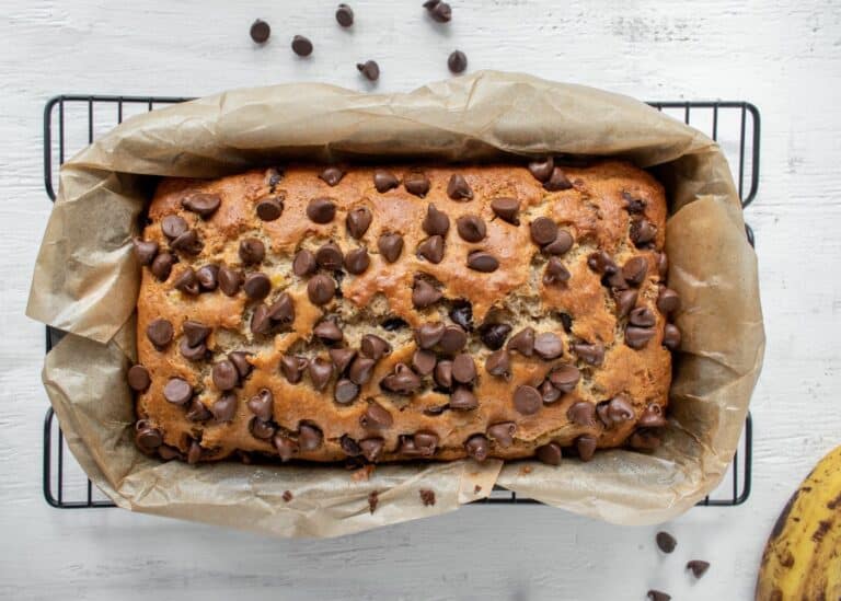 dairy free banana bread on cooling rack with chocolate chips.