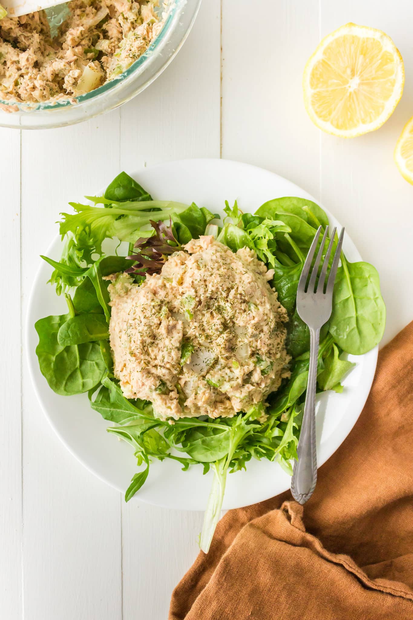 A plate of canned salmon salad with greens.