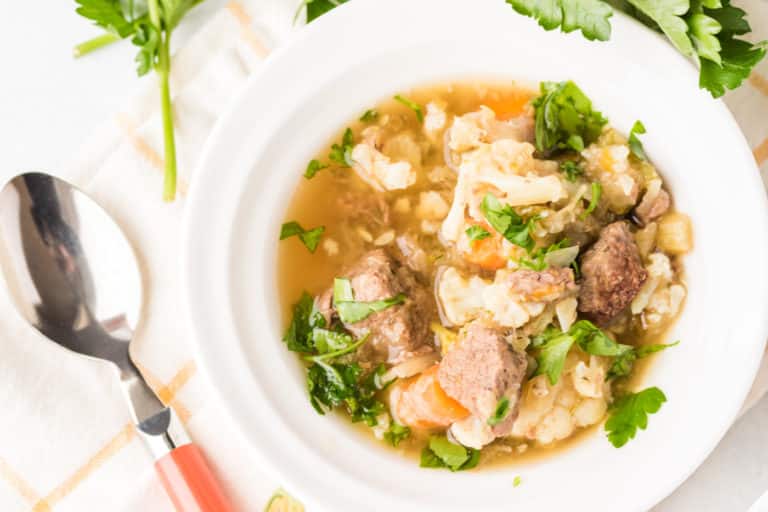 venison beef stew in white bowl