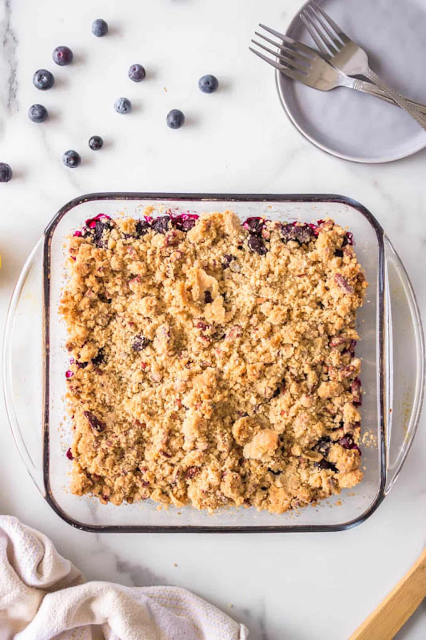 baked blueberry crisp on a table.