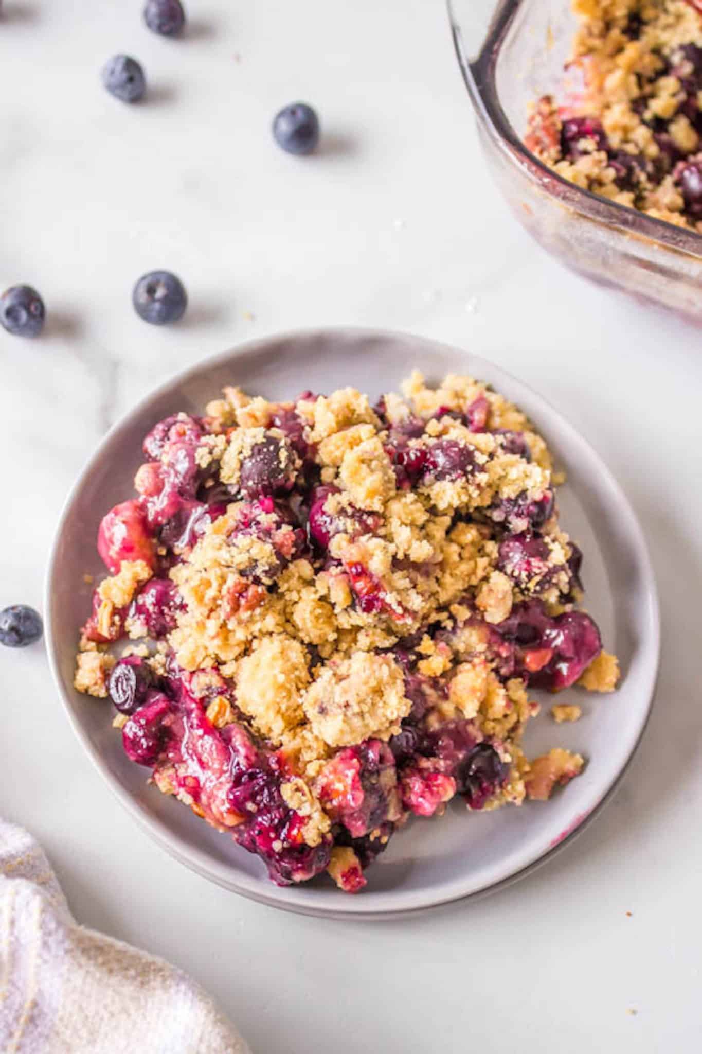 gluten-free blueberry crisp served on a plate.
