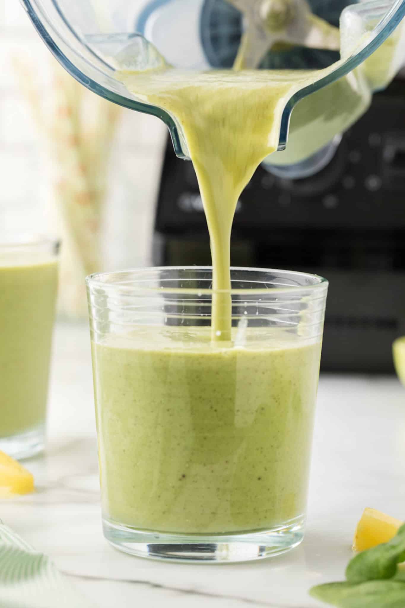 Pouring a smoothie into a cup
