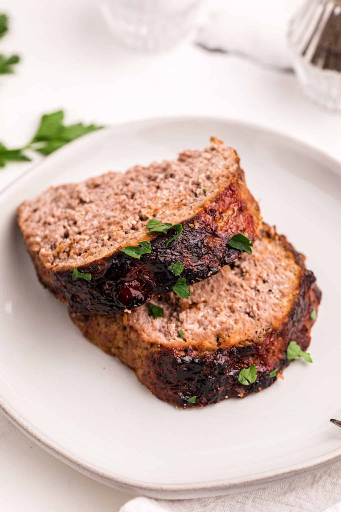 two slices of keto meatloaf on a plate.
