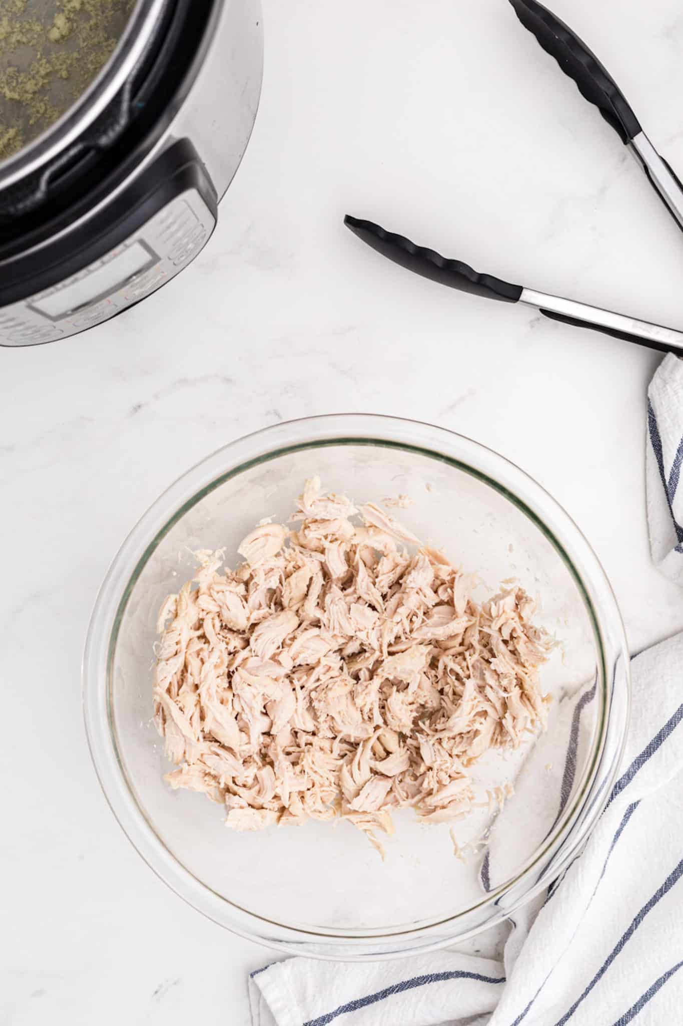 shredded chicken tenders in a bowl.