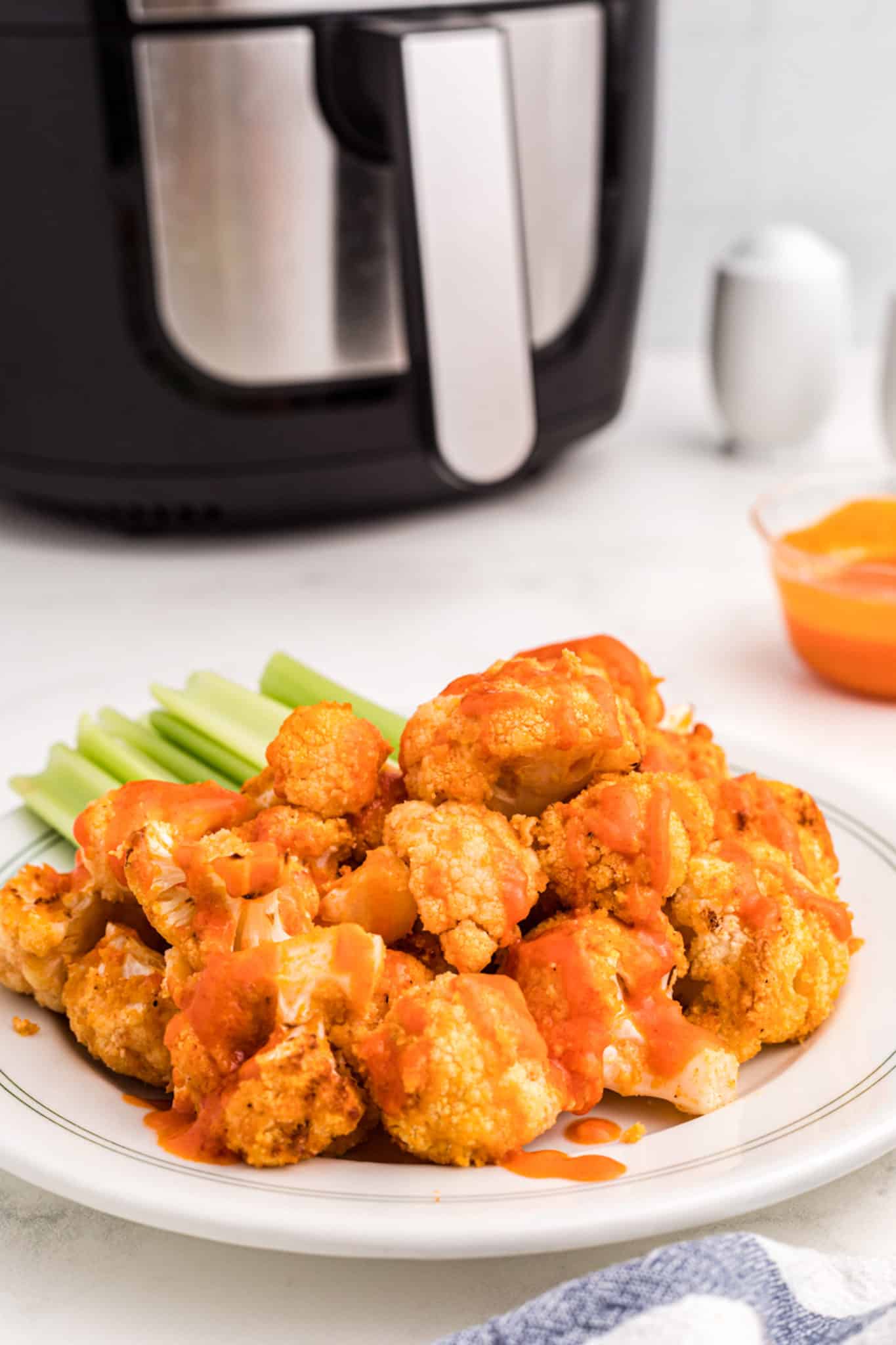 air fryer buffalo cauliflower served on a plate.