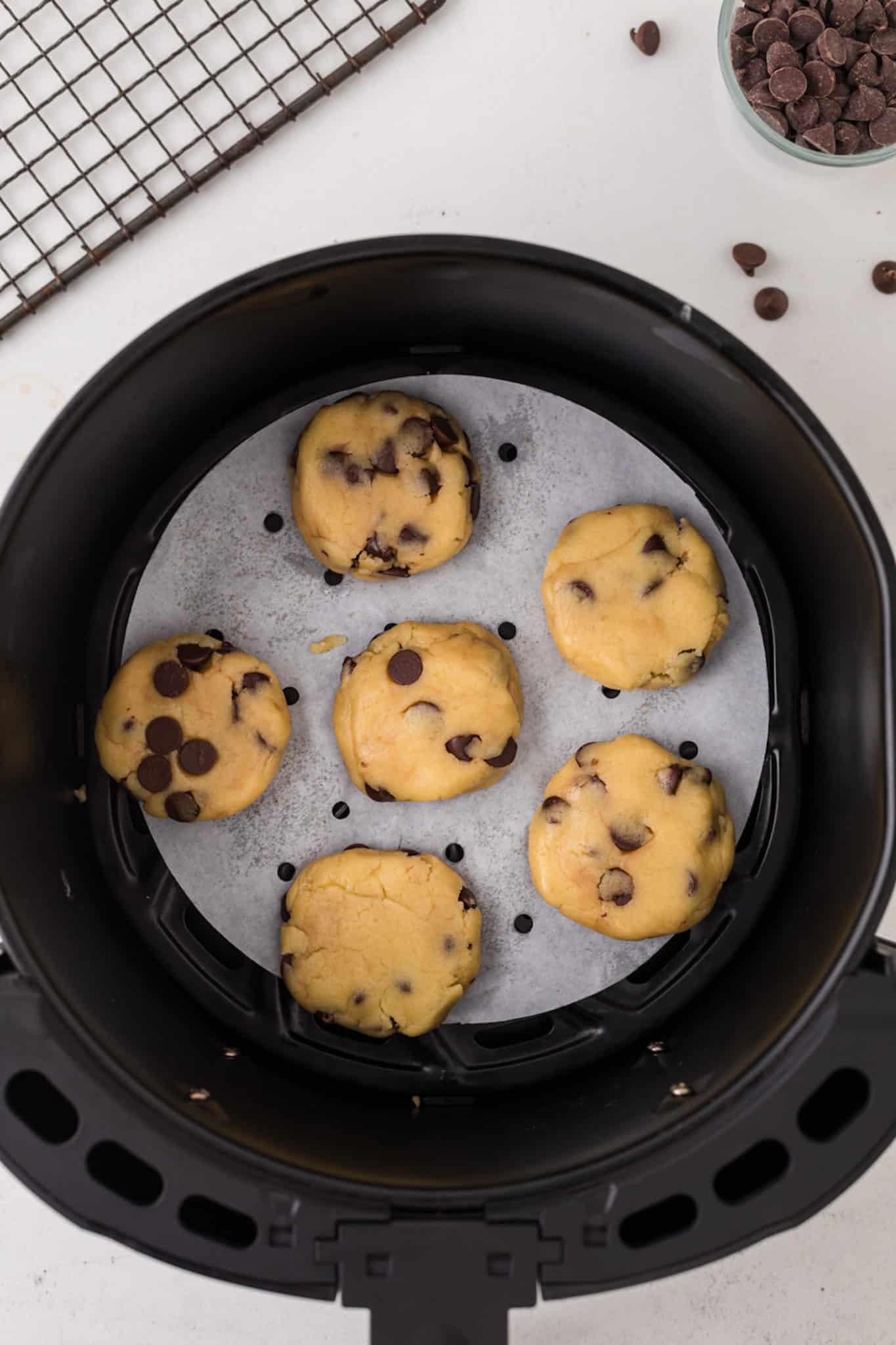 cookie dough in air fryer basket.