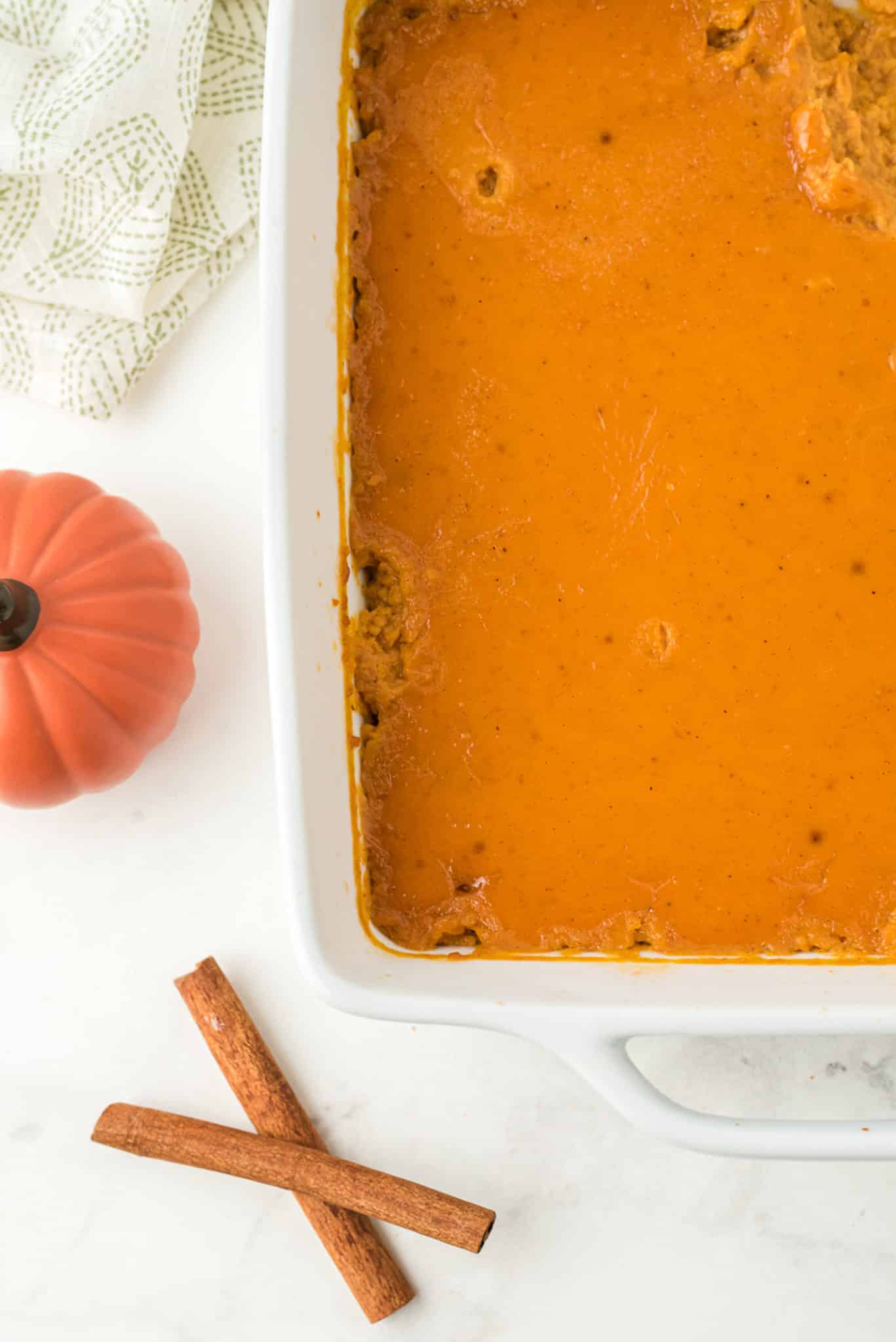 baked dairy-free pumpkin pudding in dish.