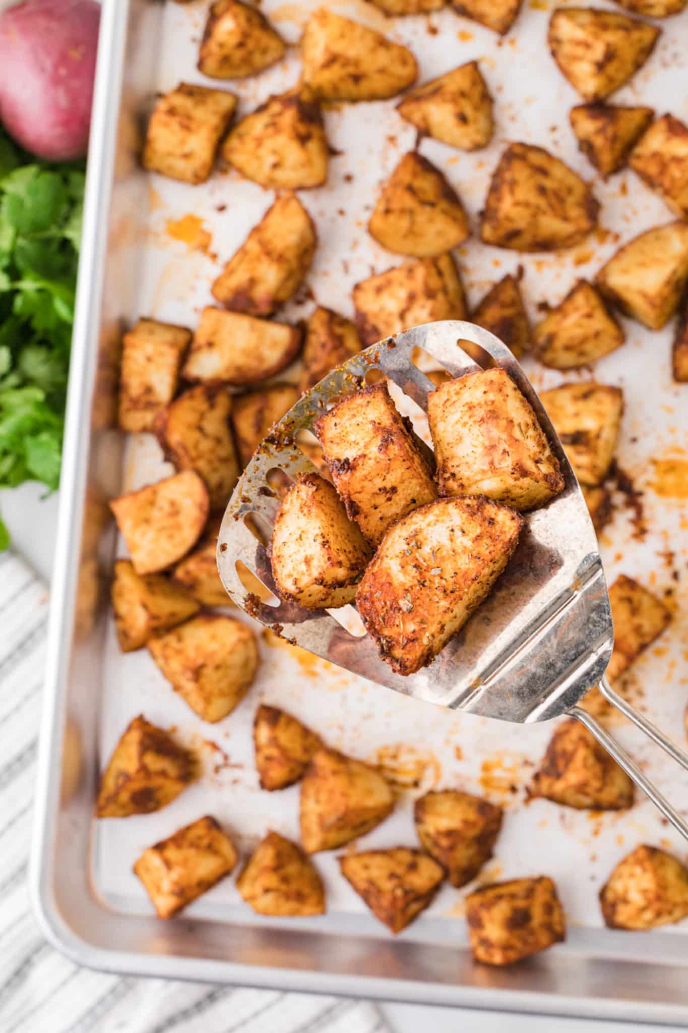 cooked potatoes on baking sheet.