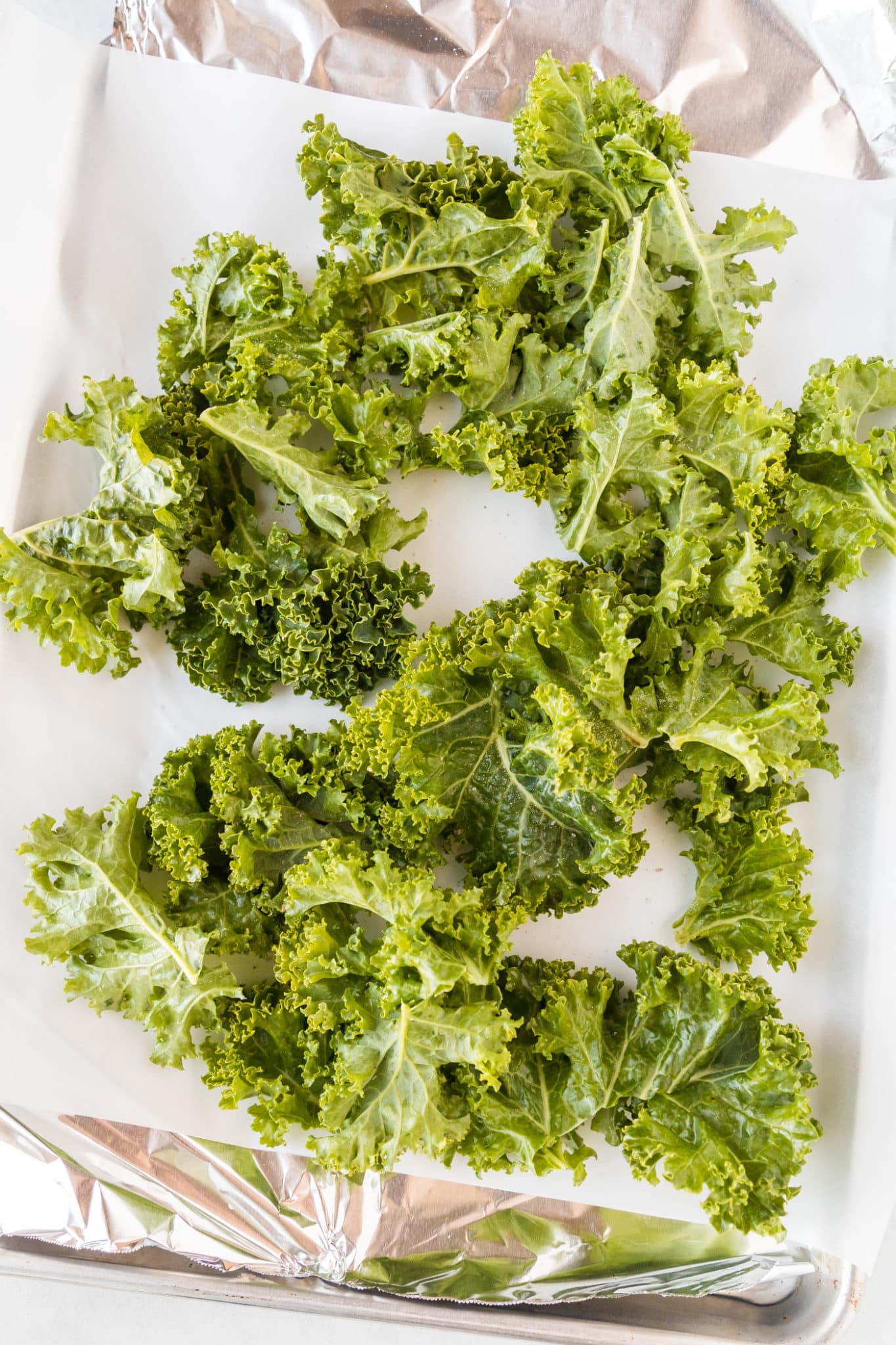 kale chips on a baking sheet
