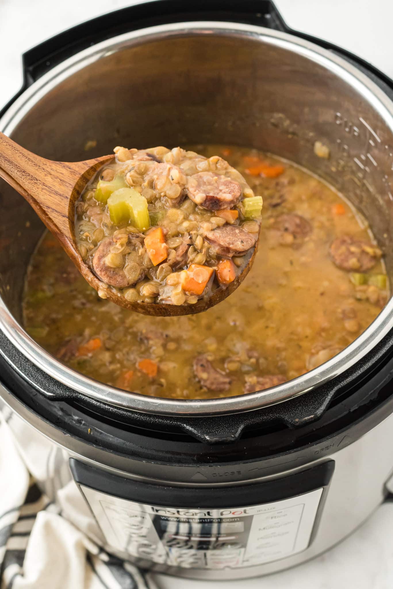 spoonful of instant pot lentil soup with sausage.