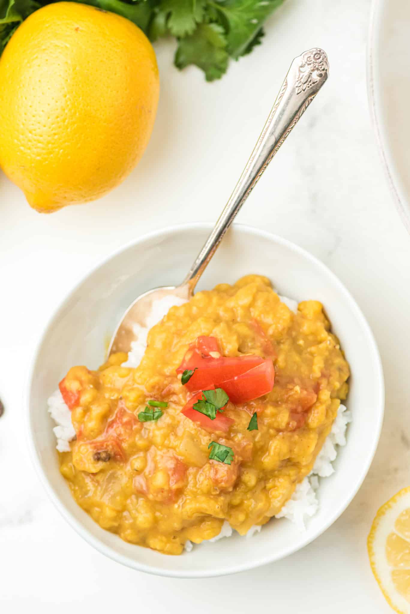 a bowl of rice with cooked instant pot red lentil dahl on top.
