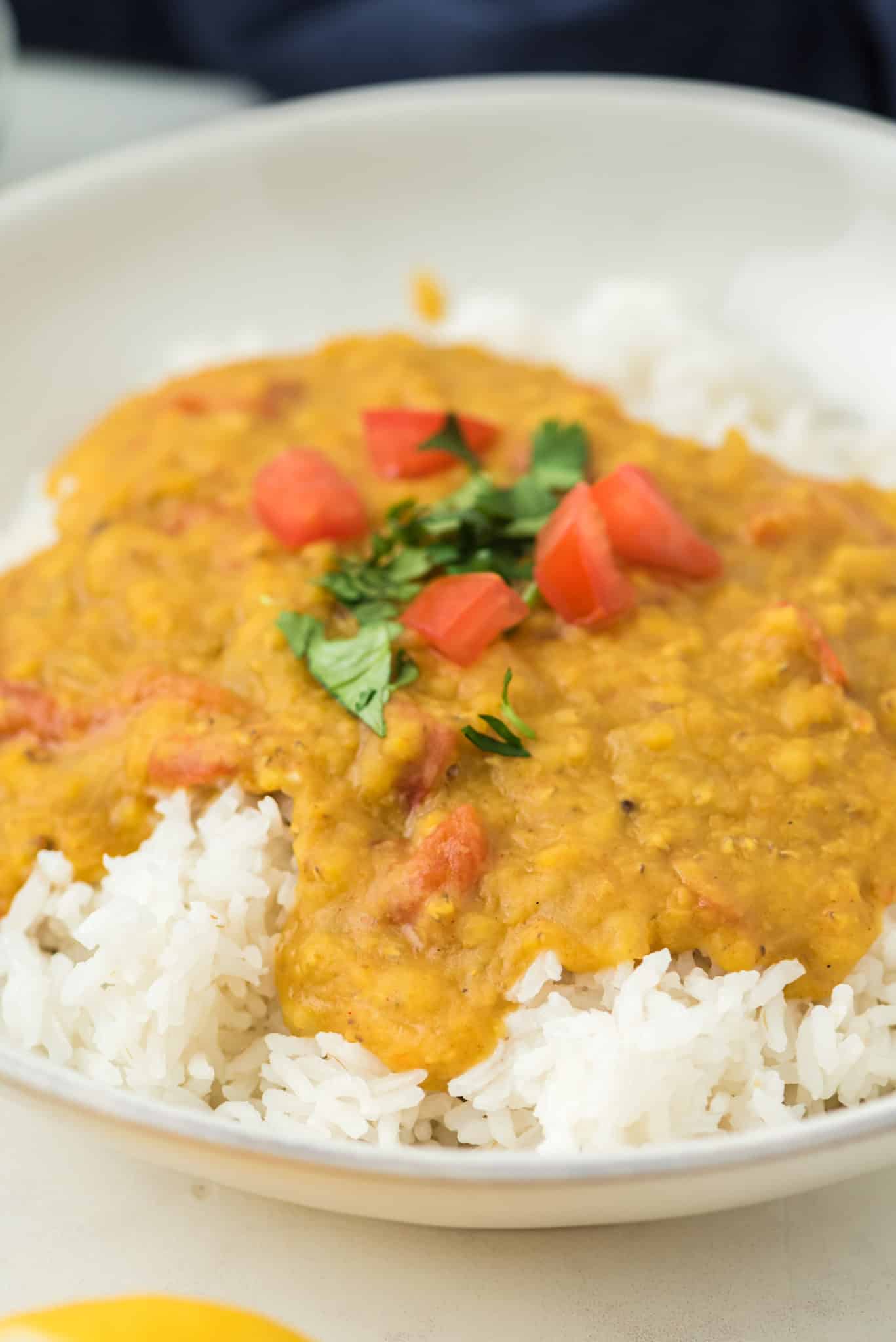 texture of red lentil dal in bowl.