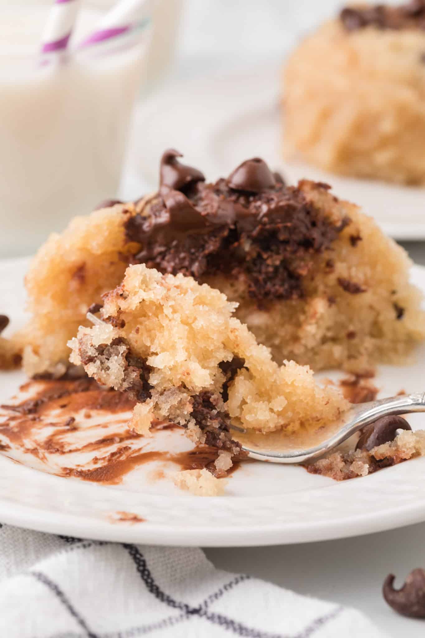 bite of vegan mug cake with a fork.