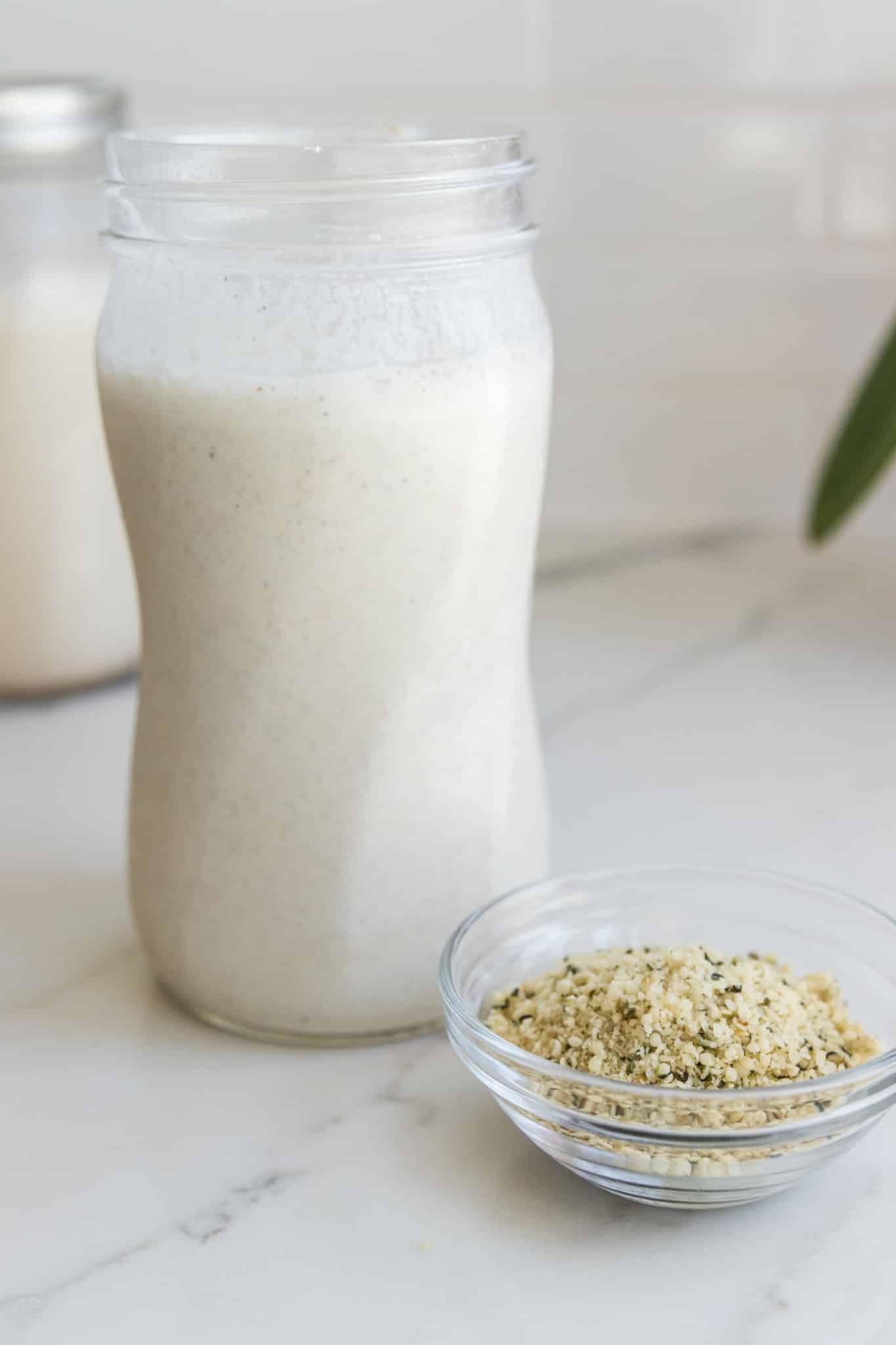 blended hemp milk in a glass jar on countertop.
