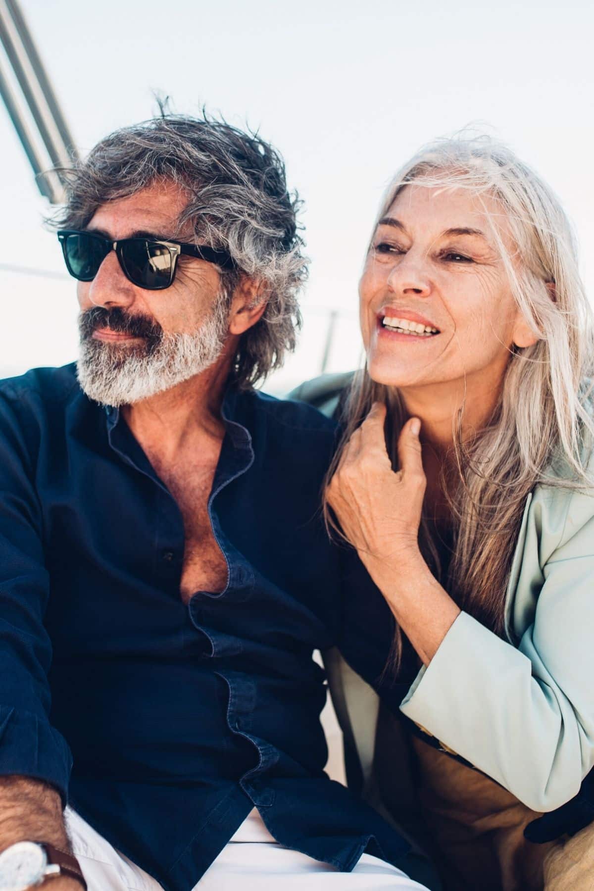 older couple on a sailboat.