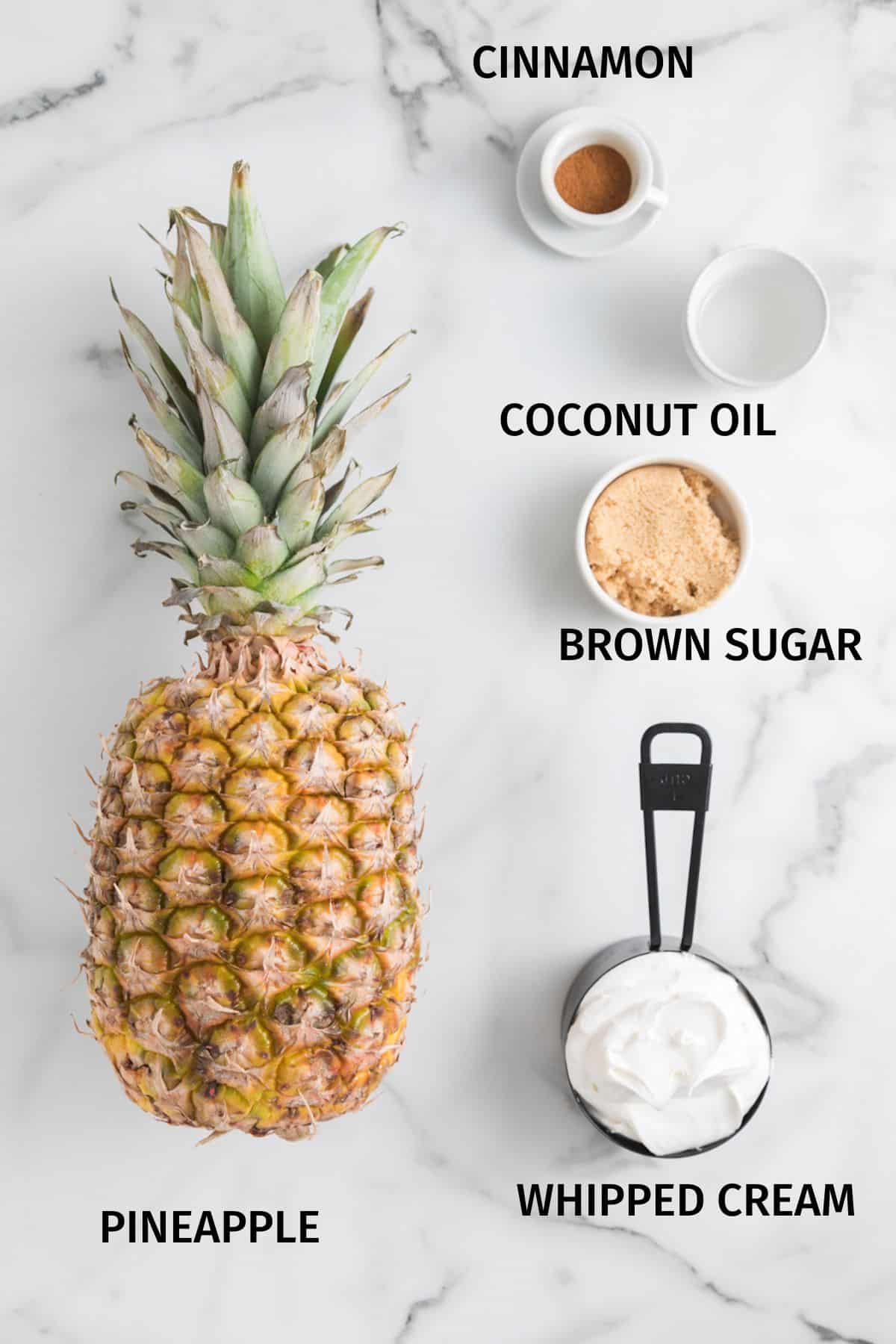 Ingredients for air fried pineapple rings on a white surface.