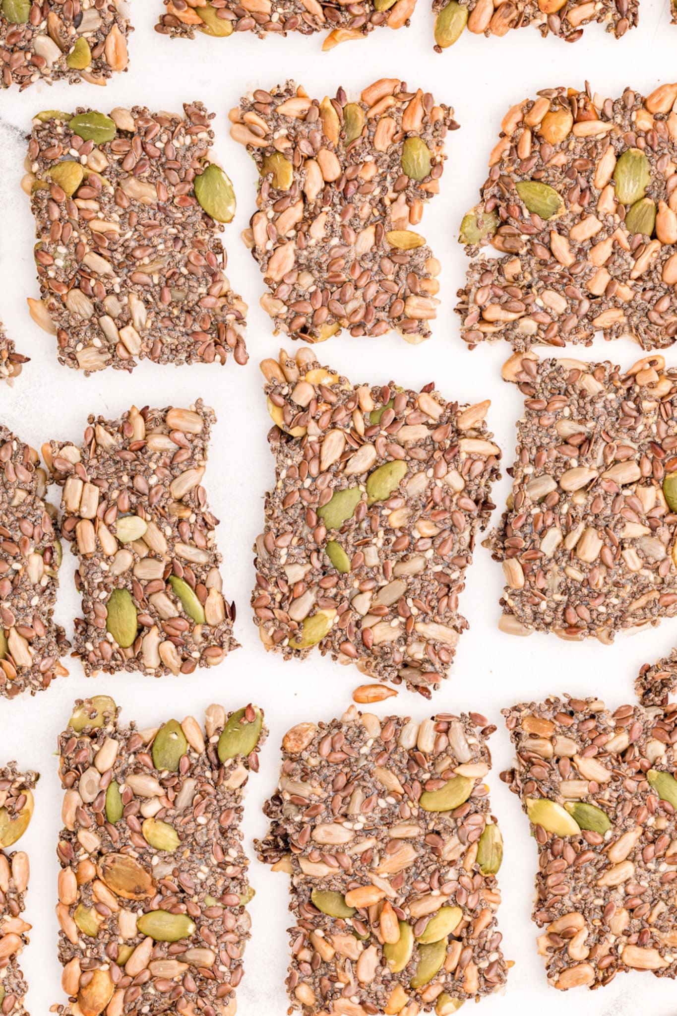Seed crackers on parchment paper.