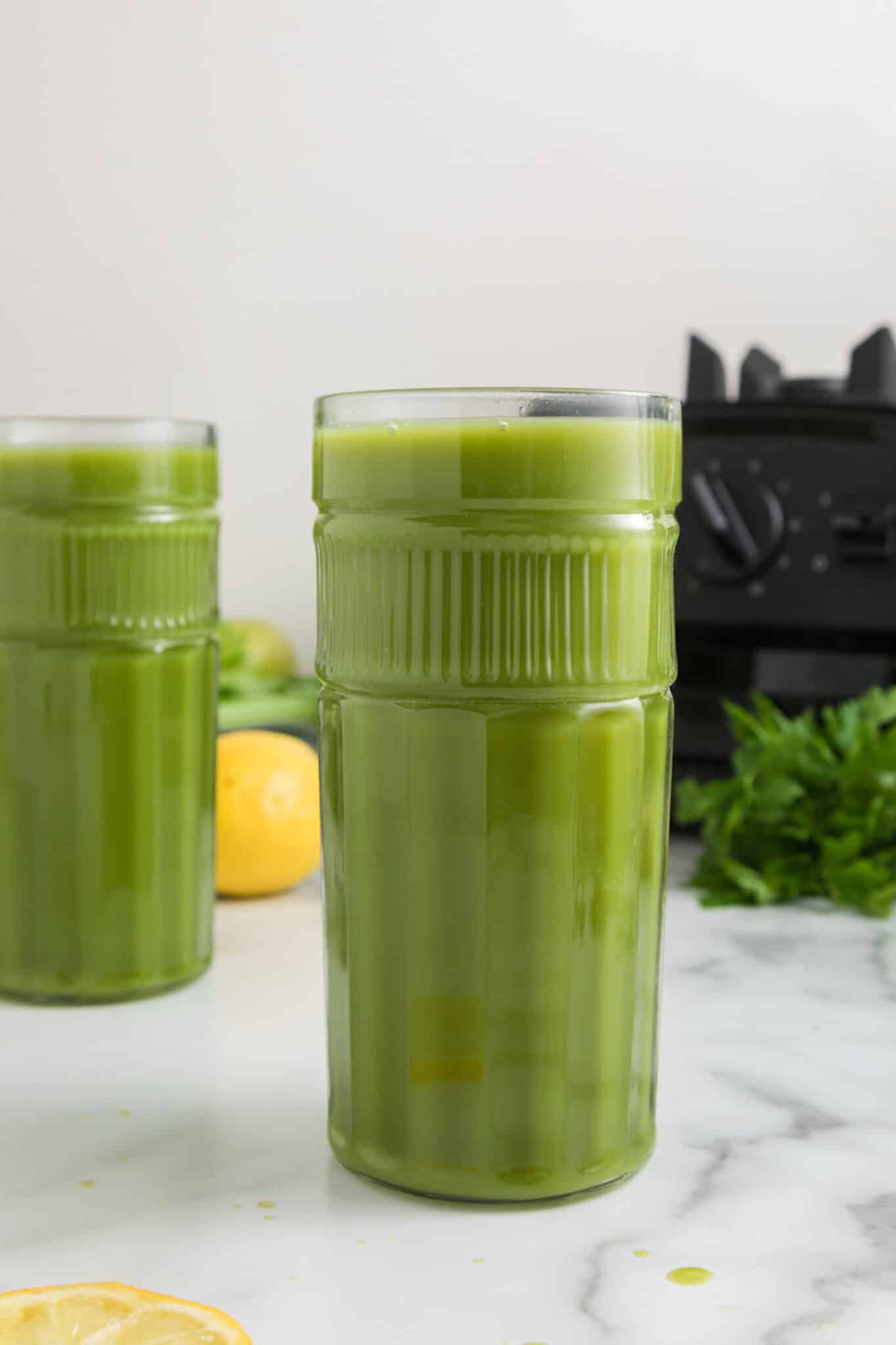 vitamix green juice served in two pretty glasses.