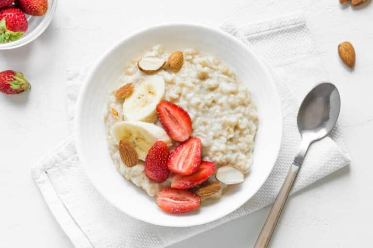 a bowl of oatmeal topped with fruit.