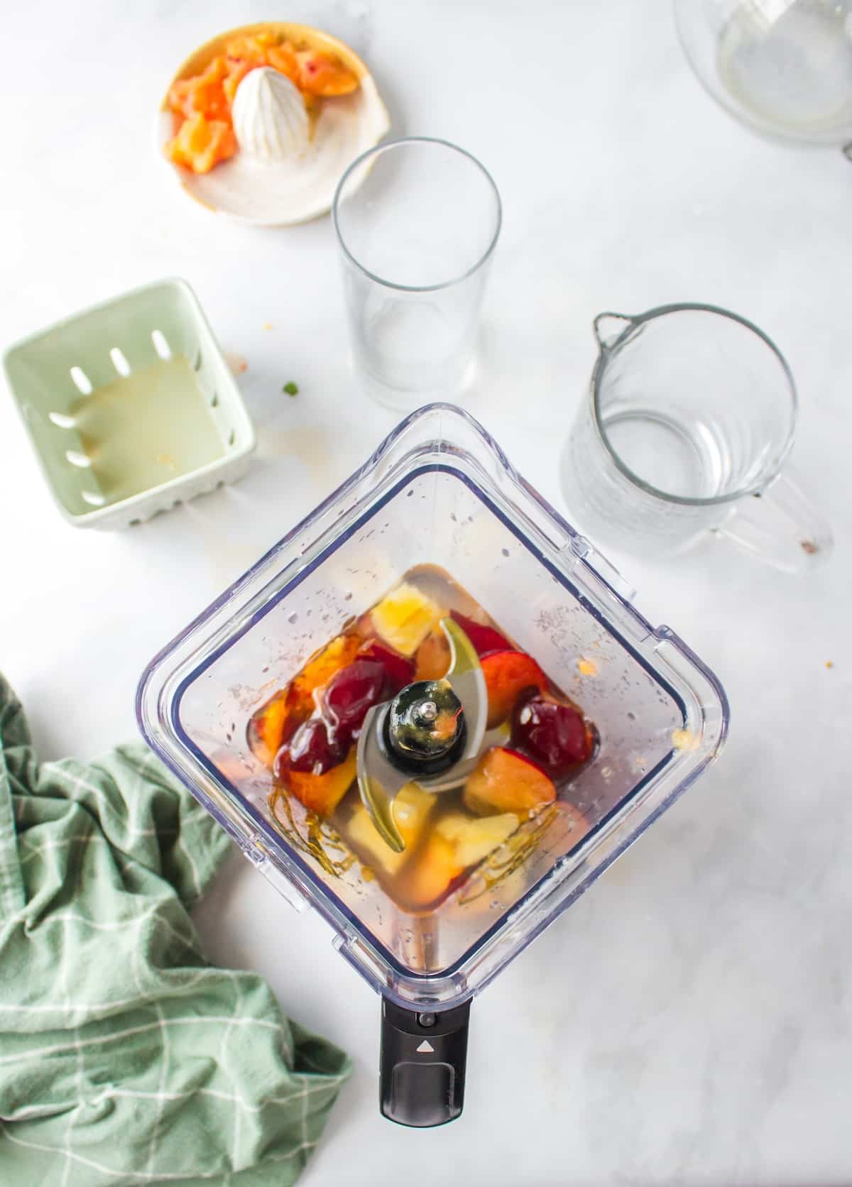making plum juice in blender.