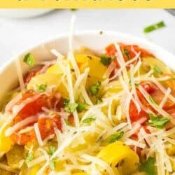 a bowl of instant pot yellow squash and tomatoes.