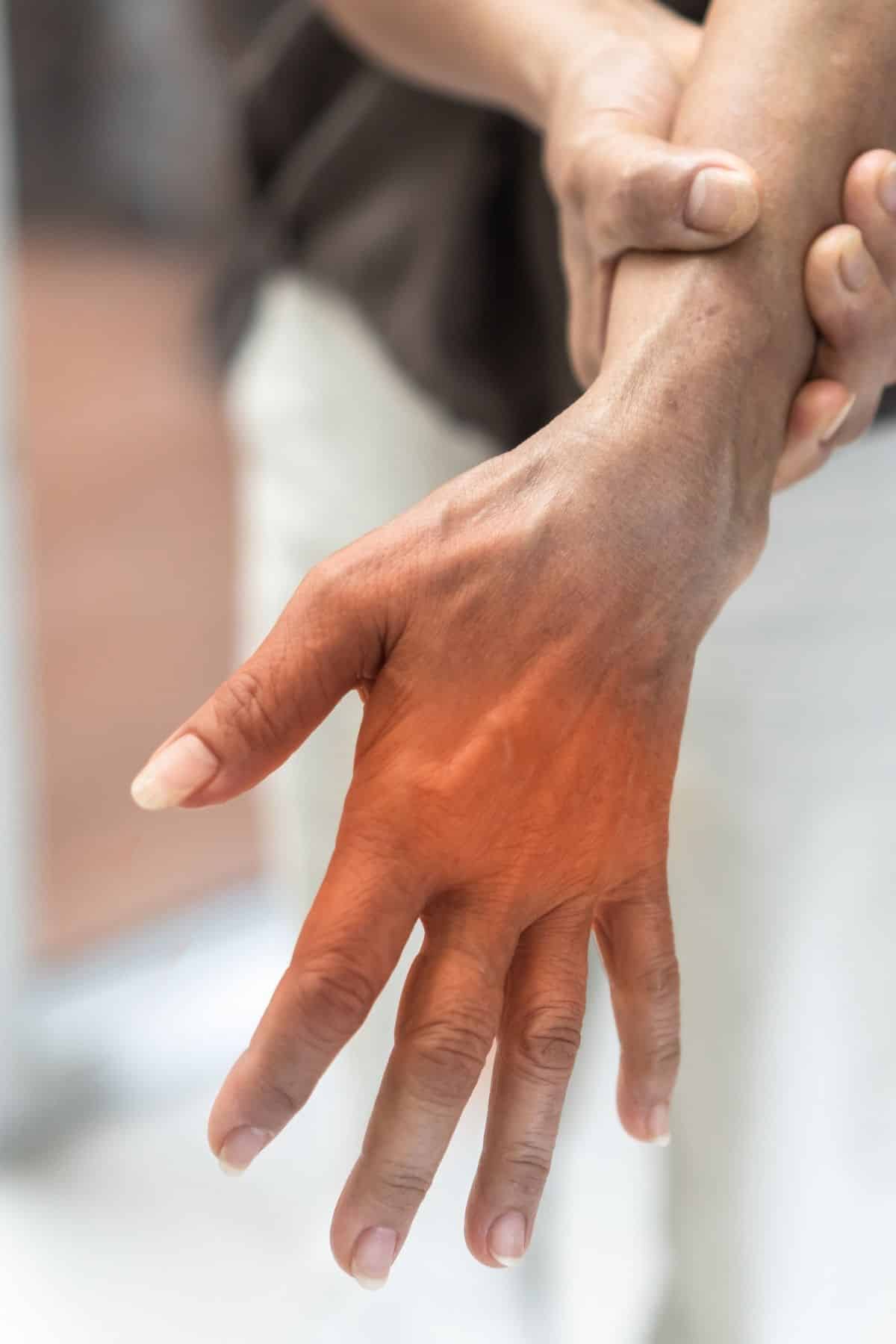 a woman holding her hand.