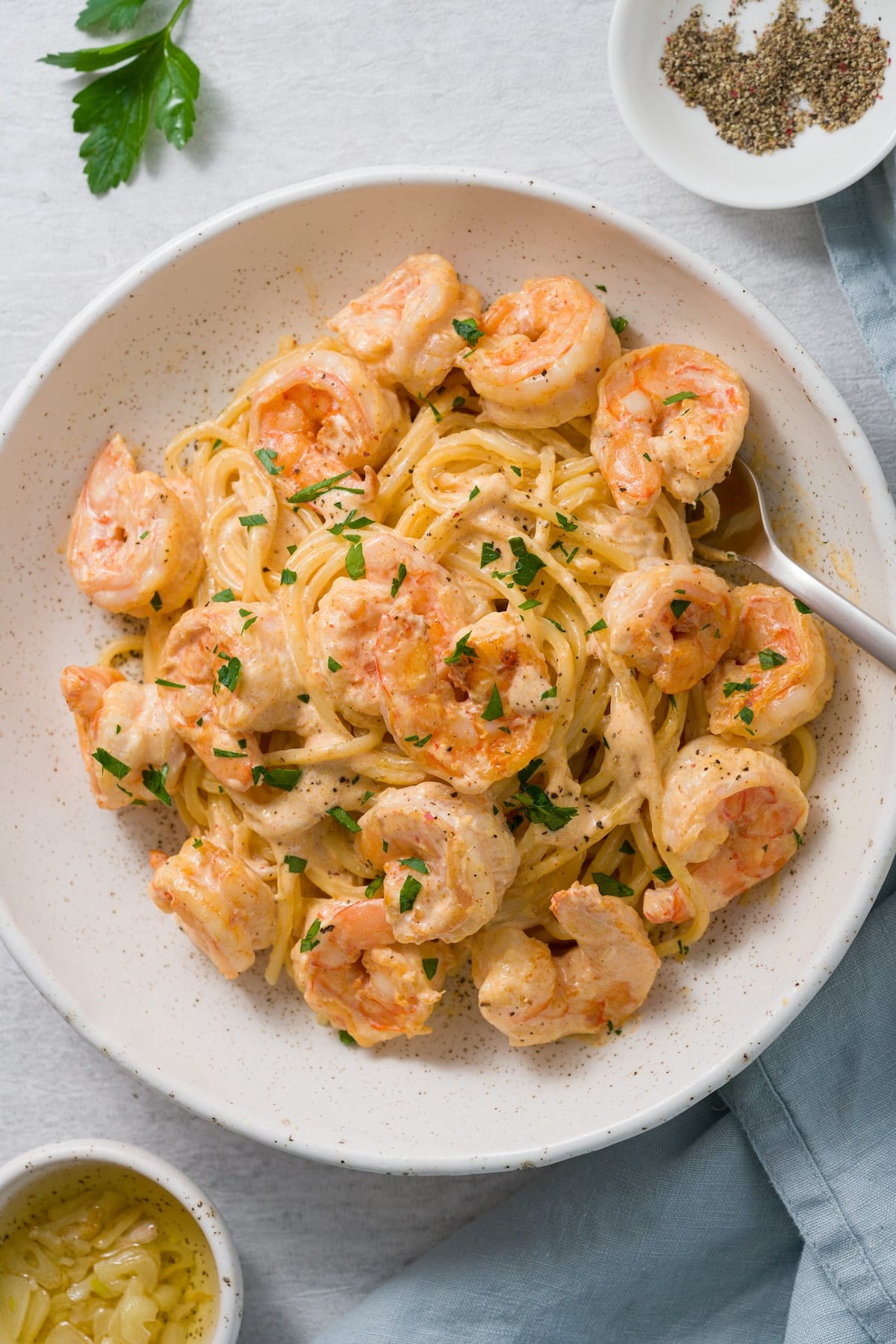 creamy coconut shrimp with dairy-free coconut sauce tossed with pasta.