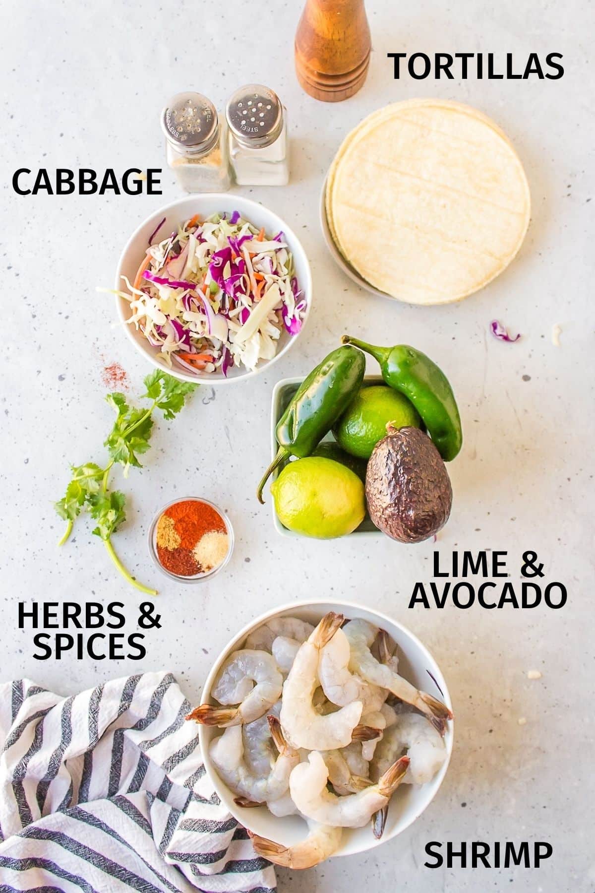 ingredients for baja shrimp tacos on a white counter.