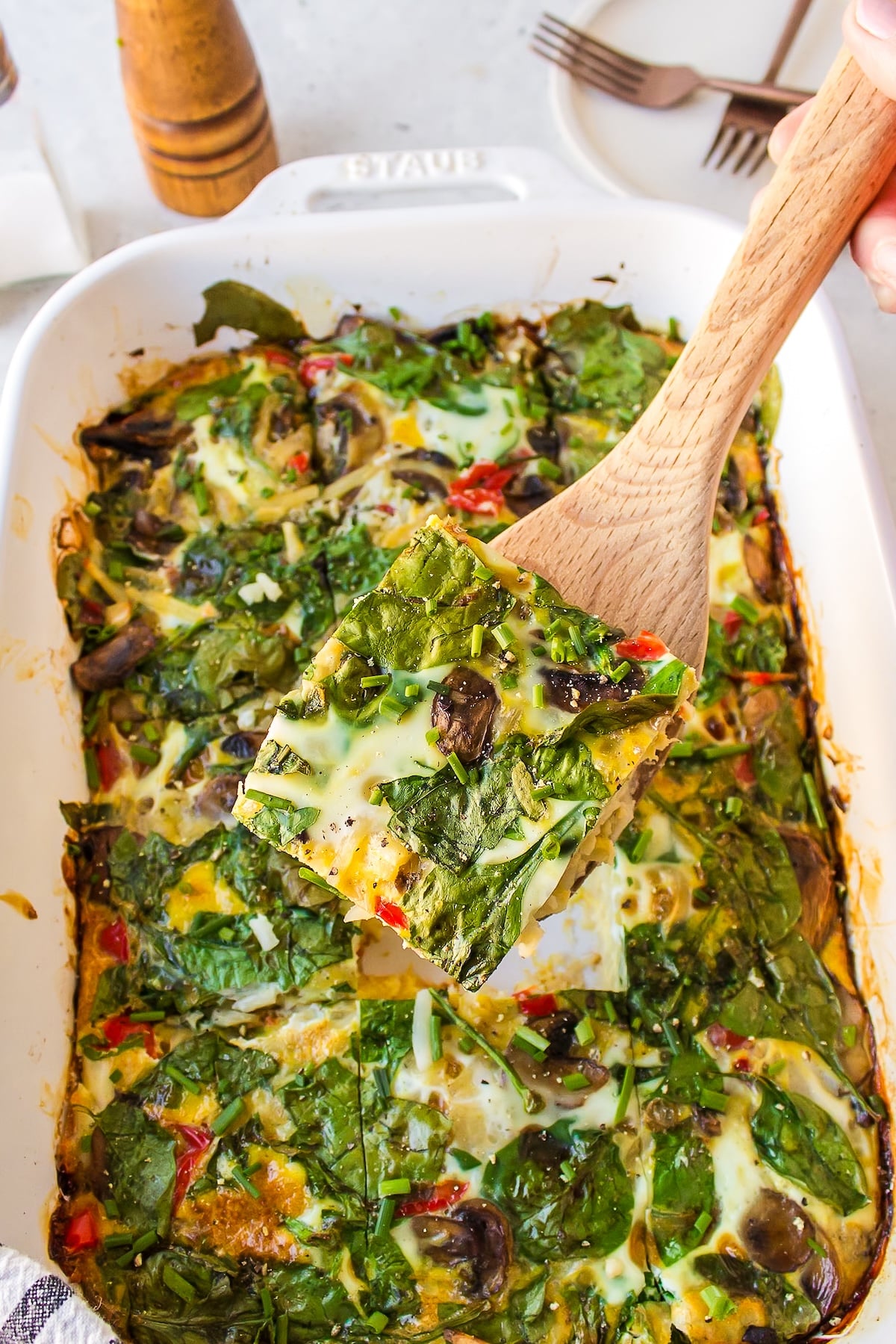 a piece of dairy-free breakfast casserole on a spatula.