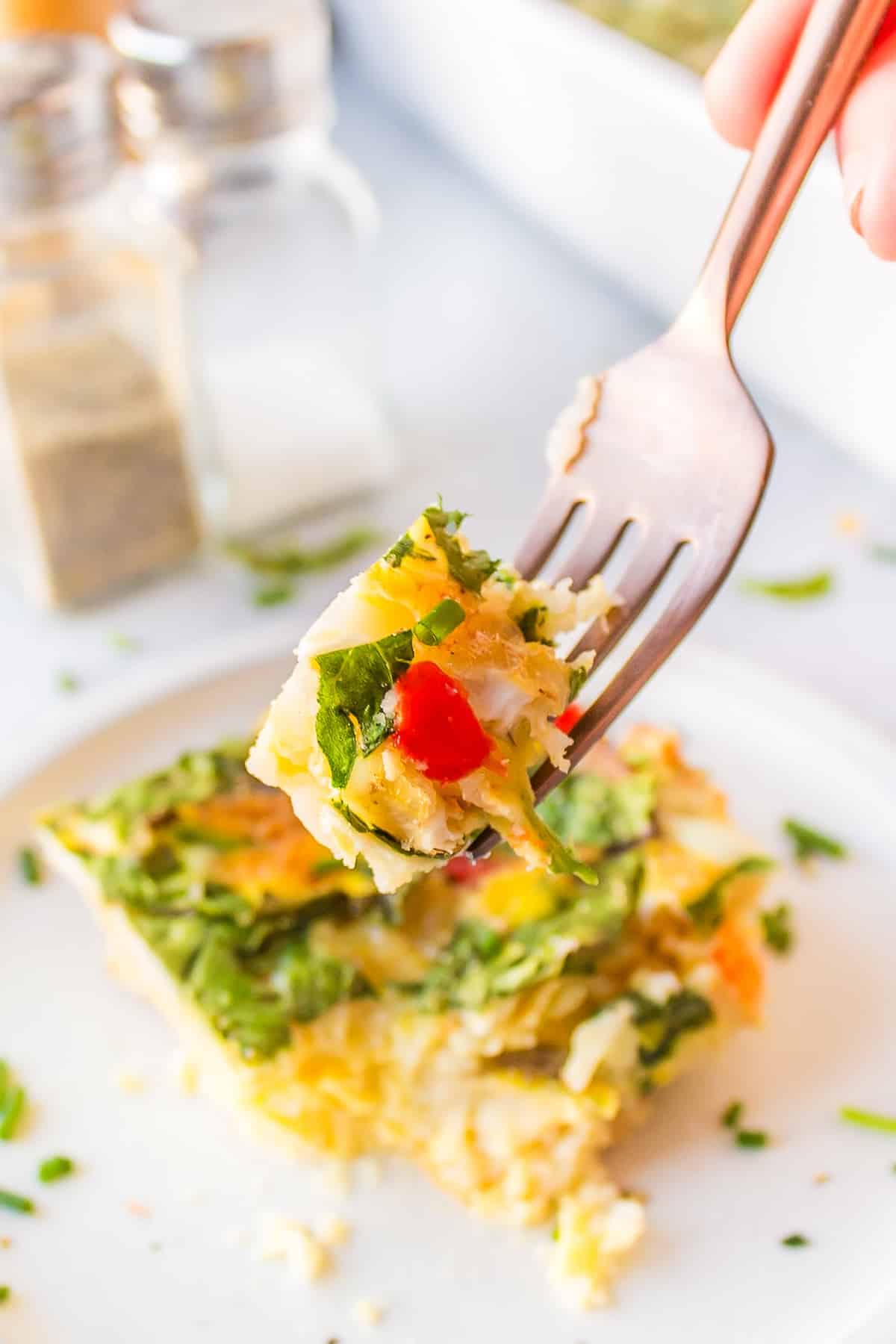 a bite of dairy-free breakfast casserole on a fork.