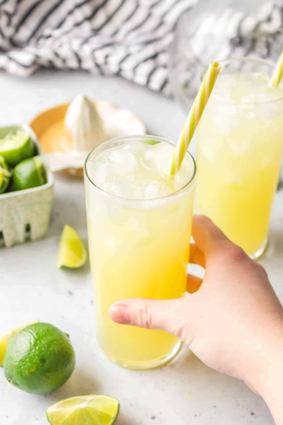 a person holding a ginger beer mocktail.