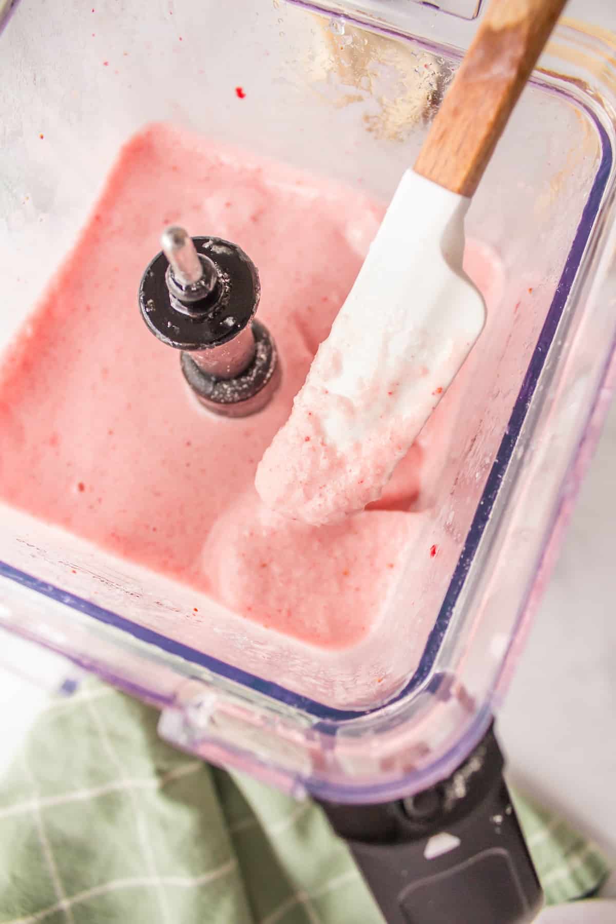 smoothie ingredients blended together in a blender.
