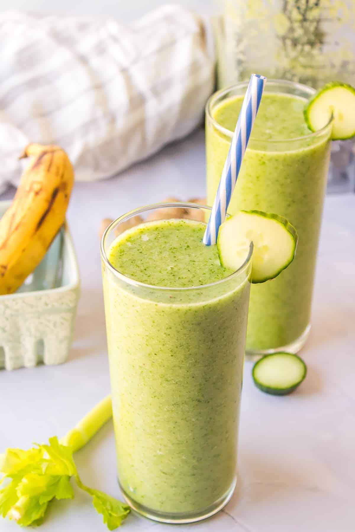 two glasses of celery cucumber smoothie.