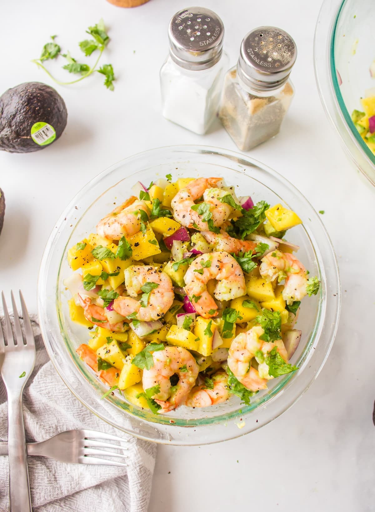 a bowl of avocado mango shrimp salad.