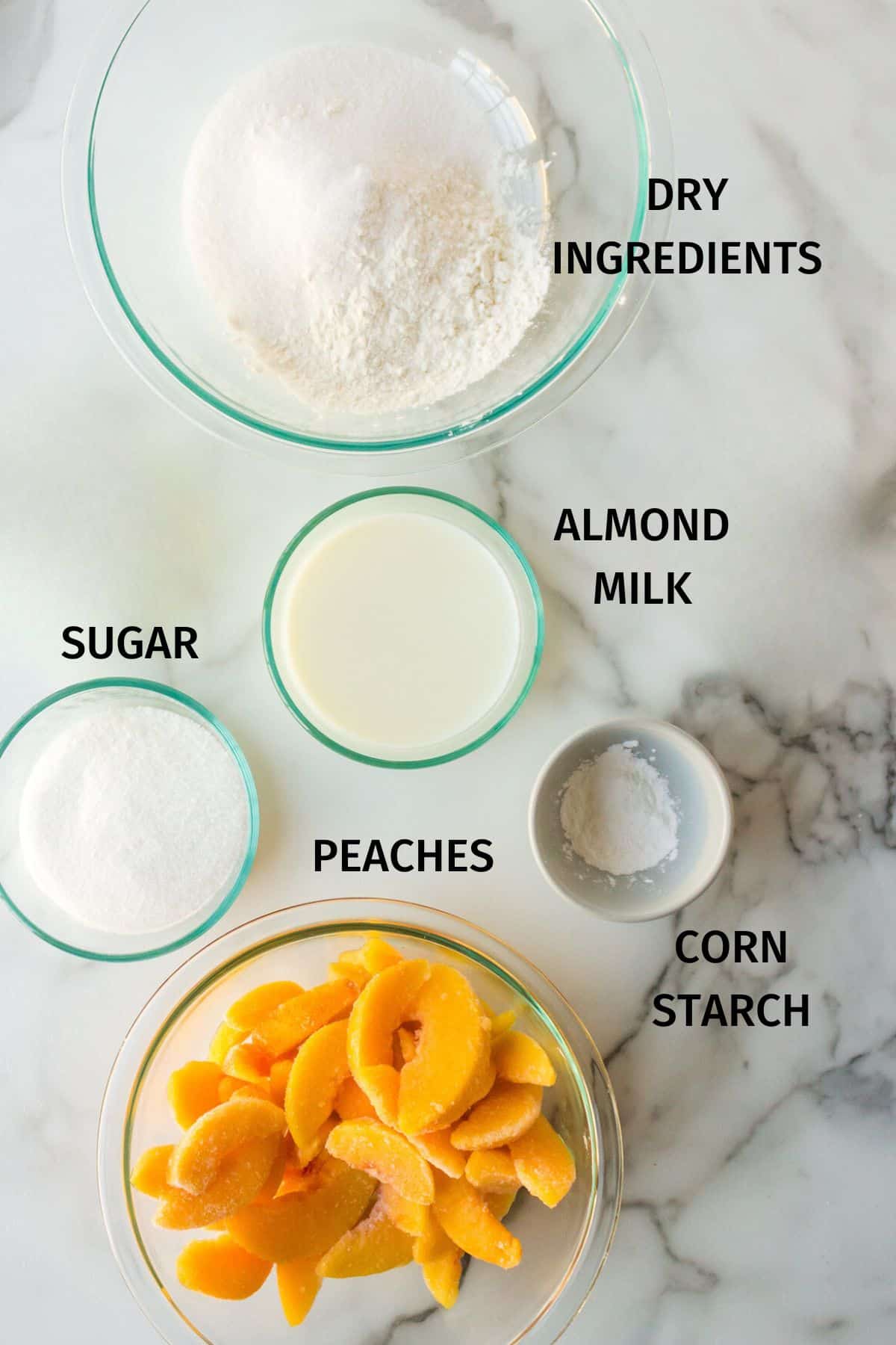 ingredients for almond flour peach cobbler using frozen peaches.
