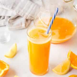 a glass of healthy yellow juice.